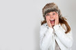 Girl in winter clothing with suprised look