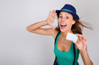 Beautiful stylish girl holding pass ticket