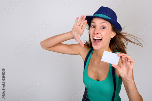 Photo: Beautiful stylish girl holding pass ticket Beautiful stylish girl holding pass ticket