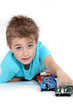 Foto: Little boy playing with toy cars Little boy playing with toy cars