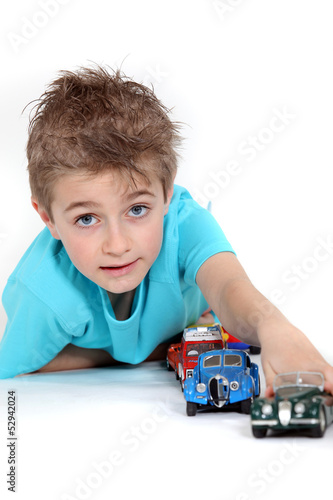 Photo: Little boy playing with toy cars Little boy playing with toy cars