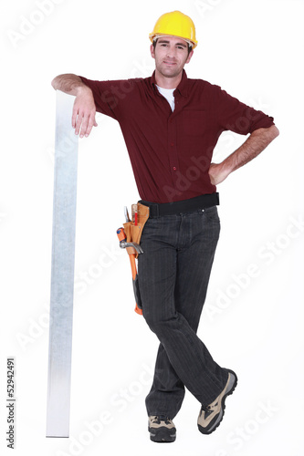 Photo: Tradesman leaning against a girder Tradesman leaning against a girder