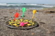 Arrows in a target board, at the beach