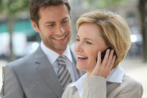 Photo: Businessman and woman laughing Businessman and woman laughing