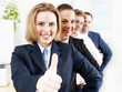 Foto: Successful business people are in line, show thumb up Successful business people are in line, show thumb up