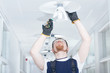 Man Fixing Lamp