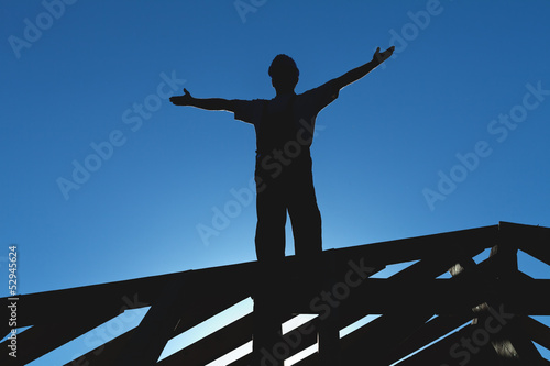 Photo: Worker welcoming the sun starting the workday Worker welcoming the sun starting the workday