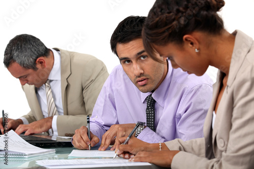Photo: Businesspeople writing notes Businesspeople writing notes