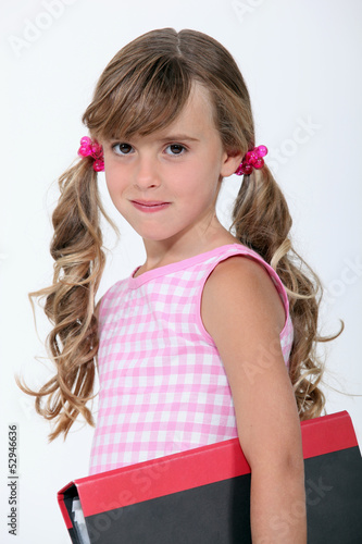 Photo: Young girl off to school Young girl off to school