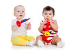 Babies girls play musical toy