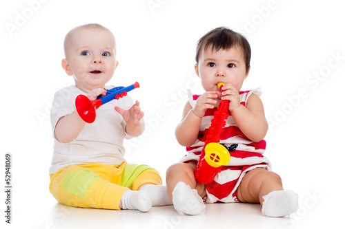 Photo: Babies girls play musical toy Babies girls play musical toy