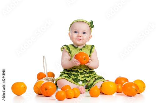 Photo: happy baby girl with fruits isolated on white background happy baby girl with fruits isolated on white background
