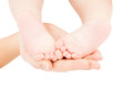 mother's hand holding baby feet