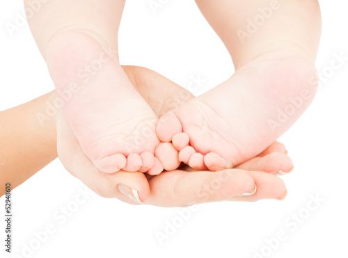 Photo: mother's hand holding baby feet mother's hand holding baby feet