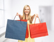 excited woman with shopping bags