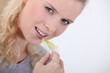 Woman eating a crisp