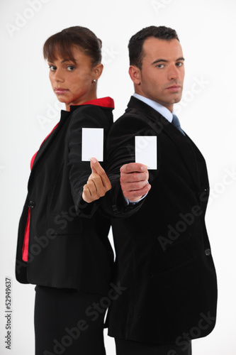 Photo: Executives with blank business cards Executives with blank business cards