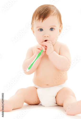 Photo: curious baby brushing teeth curious baby brushing teeth