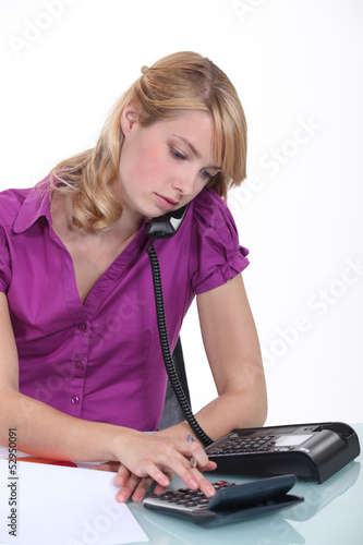 Photo: An accountant over the phone. An accountant over the phone.