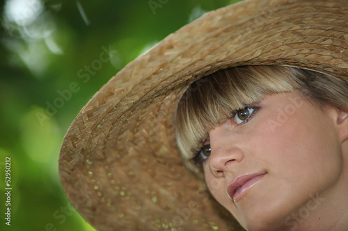 Photo: Portrait of woman with straw hat Portrait of woman with straw hat