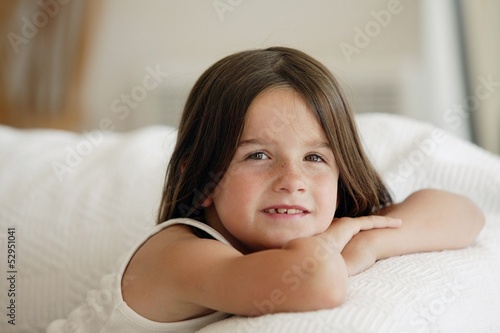 Photo: little girl posing on the sofa little girl posing on the sofa