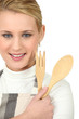 a blonde woman with wooden flatware