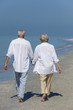 Happy Senior Couple Walking Holding Hands Tropical Beach
