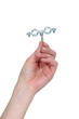Photo: Hand holding a piece of metal. Hand holding a piece of metal.