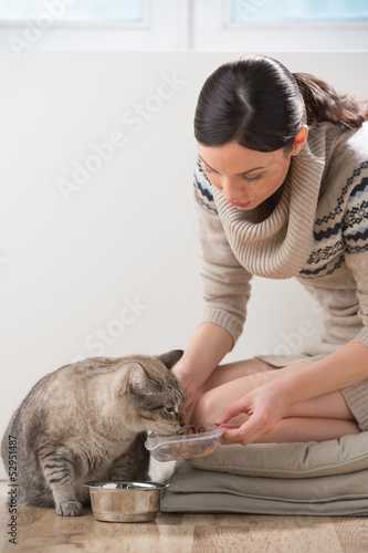 Photo: Beautiful young woman and her cat Beautiful young woman and her cat