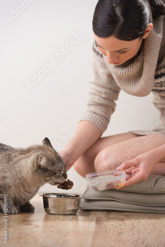 Photo: Beautiful young woman and her cat Beautiful young woman and her cat
