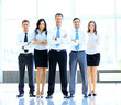 Portrait of businessman leading his team at office