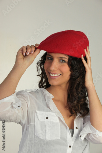 Photo: Woman wearing a red beret Woman wearing a red beret