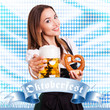 attraktive junge Frau im Dirndl mit Bierkrug und Brezel
