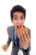 Businessman eating junk food