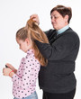 Grandmother combing hair her granddaughter
