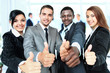 Photo: Happy business team with thumbs up in the office Happy business team with thumbs up in the office