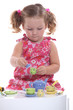 little girl playing at tea party