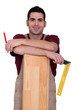 Worker stood with laminate flooring