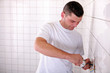 Photo: electrician installing outlet in tiled space electrician installing outlet in tiled space