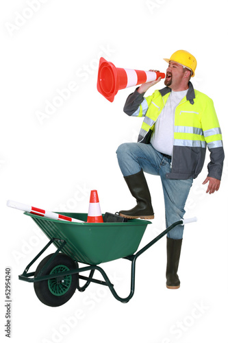 Photo: Builder shouting through cone Builder shouting through cone
