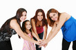 Group of young people with hands together - family concepts