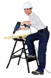 Photo: Girl using drill Girl using drill