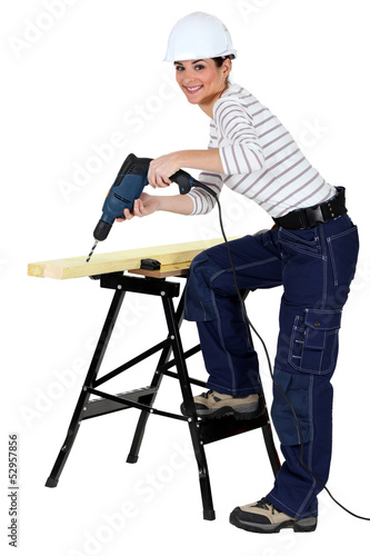Photo: Girl using drill Girl using drill