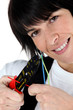 Photo: Woman cutting wire with special tool Woman cutting wire with special tool