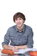 Young person writing in a workbook