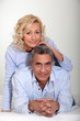 mature couple relaxing in bed
