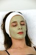 Foto: Woman receving facial at day spa Woman receving facial at day spa