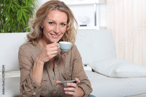 Photo: Blonde woman with coffee Blonde woman with coffee