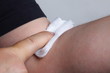 appying a swab to an arm after blood sample