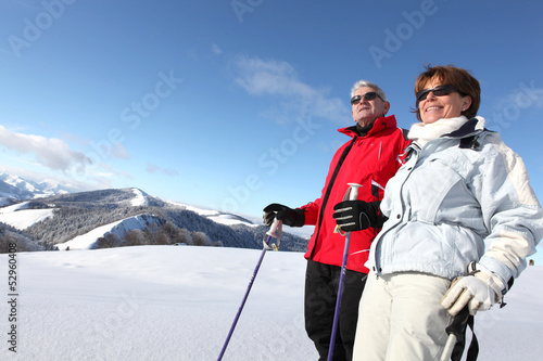 Photo: senior couple skiing senior couple skiing